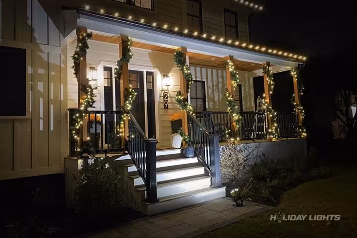 Professional residential christmas light installation in Smyrna, Delaware — Porch Garland Decorations